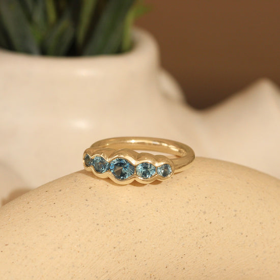 Lifestyle view of Clay 5 Ring Round Sapphires 0.4ct by Goldpoint