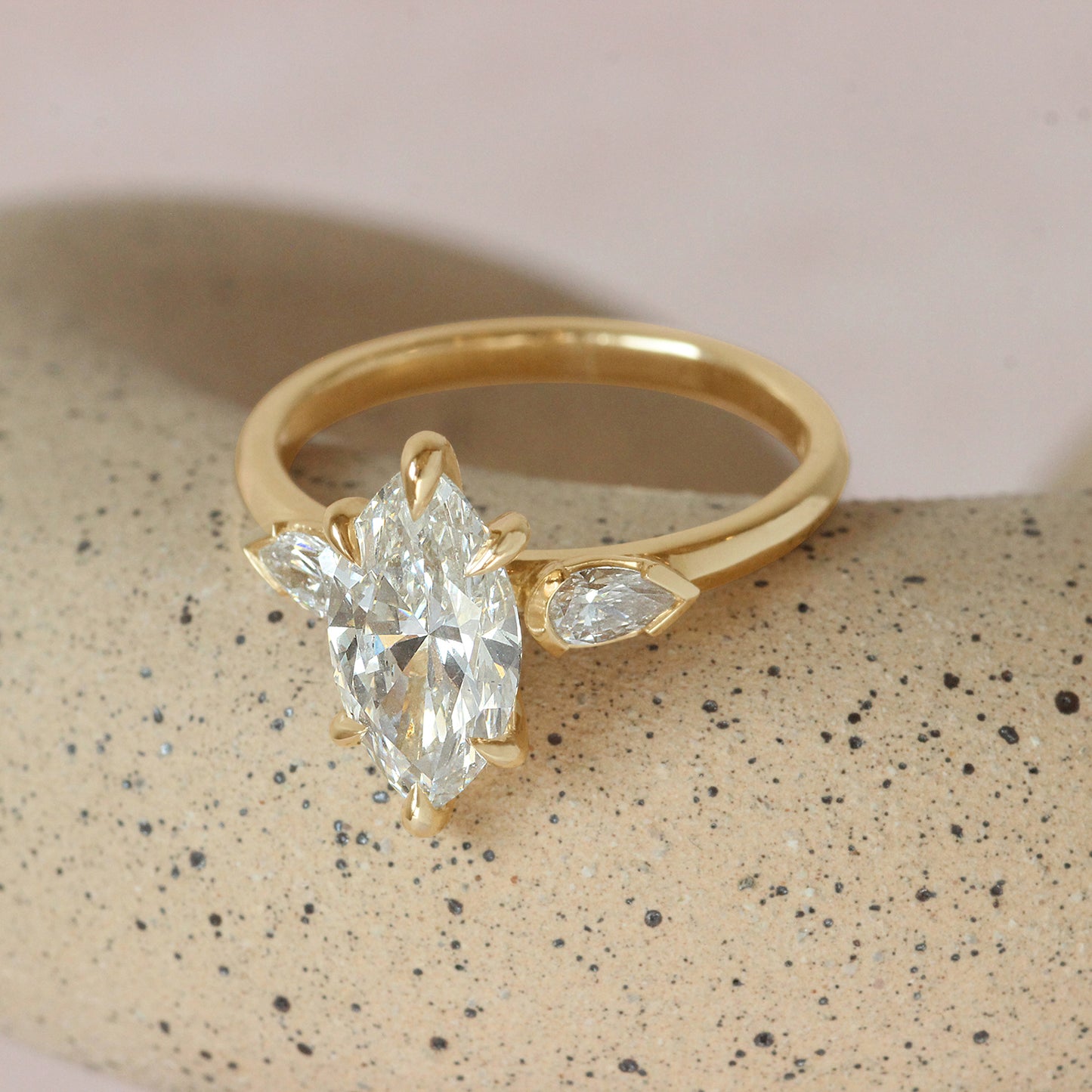 Lifestyle angled shot of Bosc Ring / Lab Marquise & Pear Diamonds