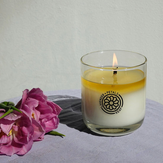 Lifestyle shot of Lavender + Petals Scented Candle burning