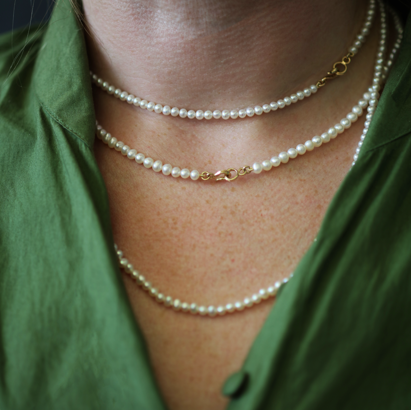 Model wears Pearl Necklace Small / Organic Shape stacked with two other pearl necklaces by Goldpoint