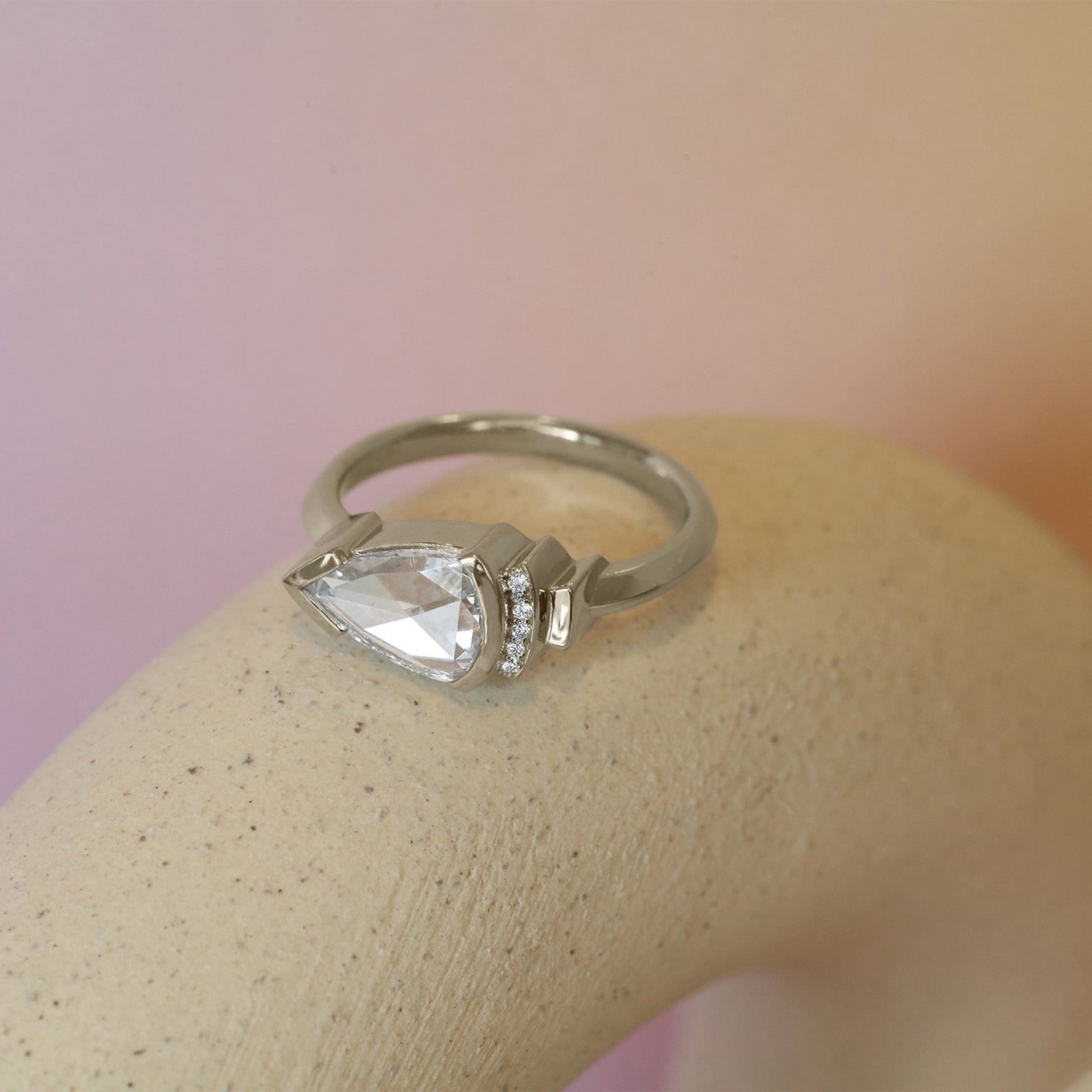 Lifestyle angled view of Step Ring / Lab Pear Rose Cut Diamond