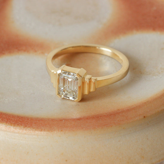 Angled view of Step Ring / Emerald Cut Diamond