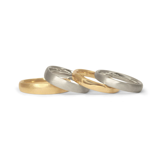 Two gold & two silver tapered Ellipse wedding bands.