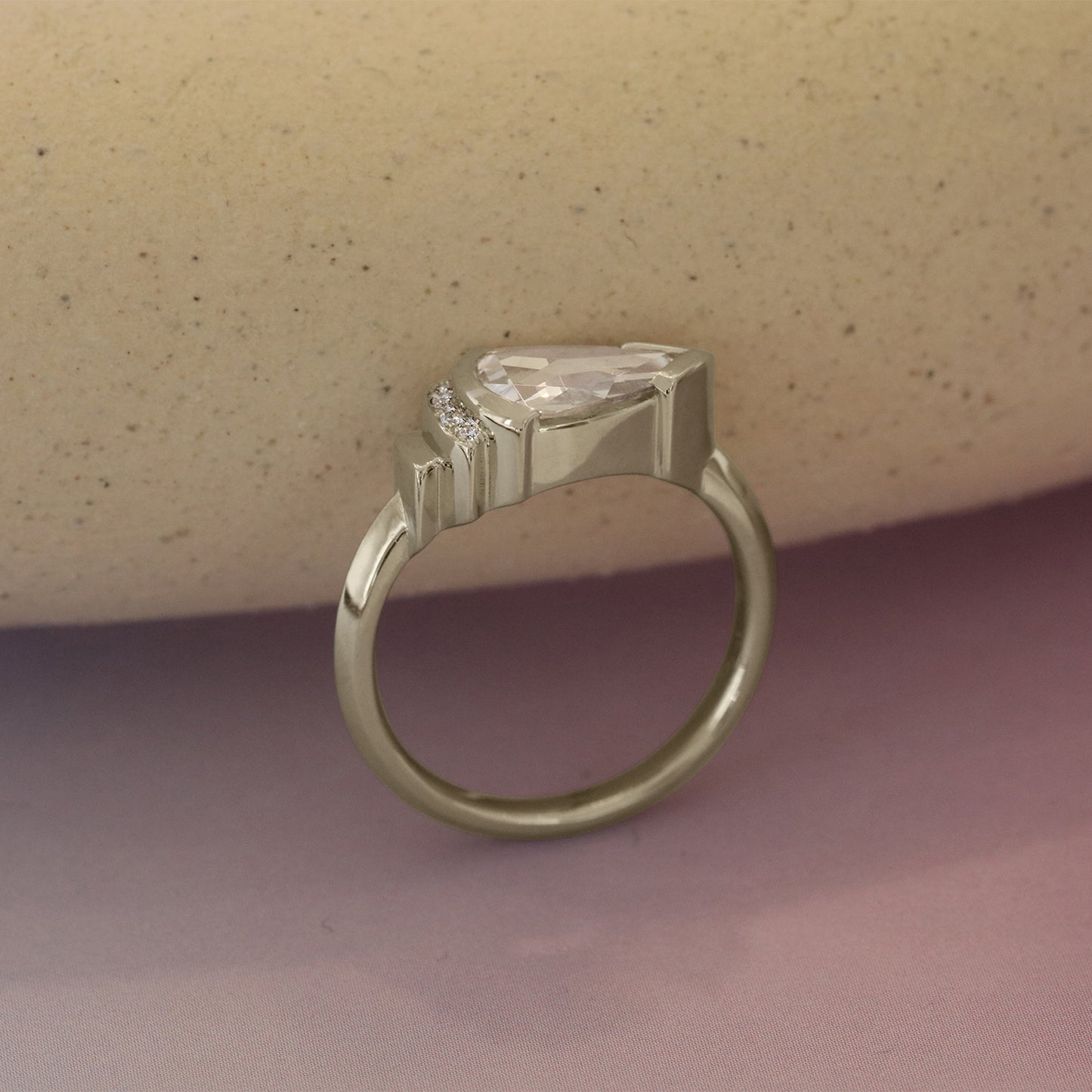 Lifestyle side profile of Step Ring / Lab Pear Rose Cut Diamond