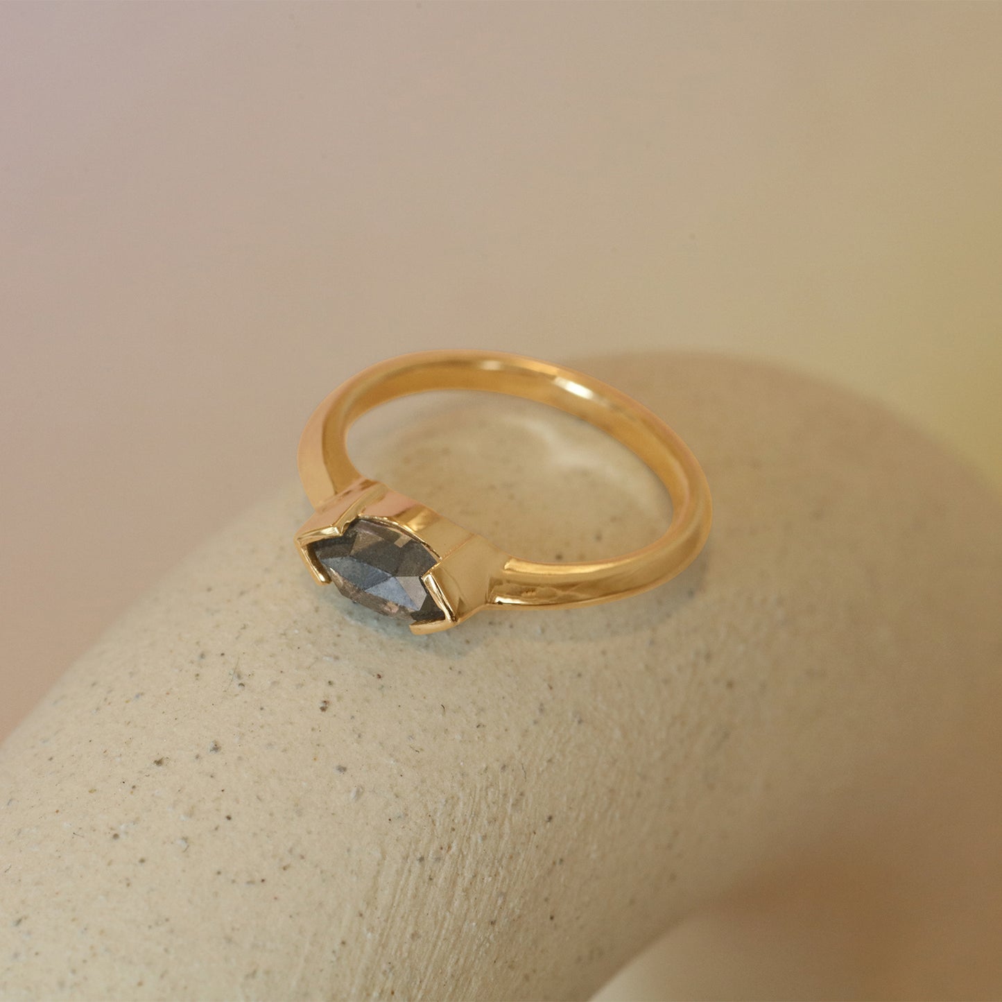 Lifestyle side view of Sideways Ring / Marquise Salt & Pepper Diamond + Yellow Gold