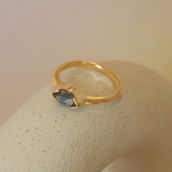 Lifestyle side view of Sideways Ring / Marquise Salt & Pepper Diamond + Yellow Gold