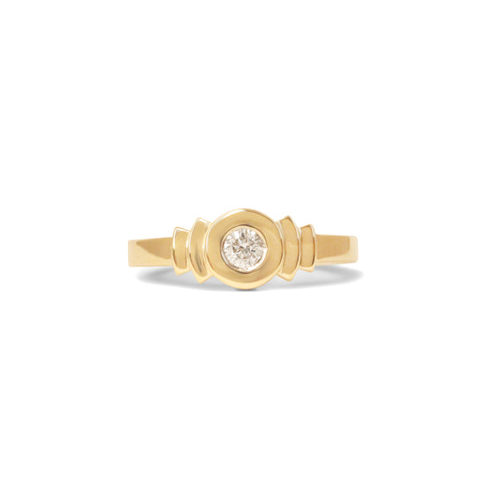 A step  signet ring in solid 14k recycled gold with a round diamond.